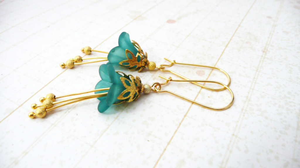 Gold and turquoise lucite flower dangle earrings by Rebekah Kreiger