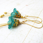 Gold and turquoise lucite flower dangle earrings by Rebekah Kreiger